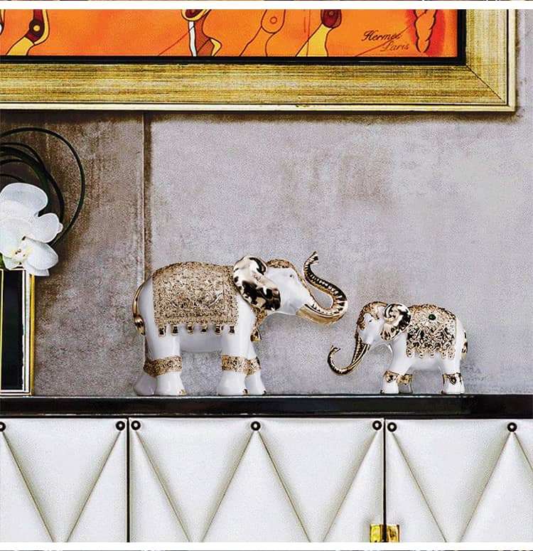 Elegant white and gold elephant decor pieces